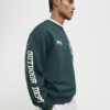 Grön oversized-tröja med alpinbadge