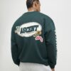 Grön oversized-tröja med alpinbadge
