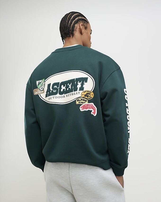Grön oversized-tröja med alpinbadge