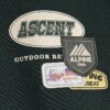 Grön oversized-tröja med alpinbadge