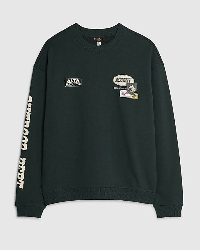 Grön oversized-tröja med alpinbadge