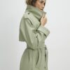 Grön trenchcoat i konstläder med bälte