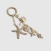 Guldfärgad sjöstjärna som bag charm