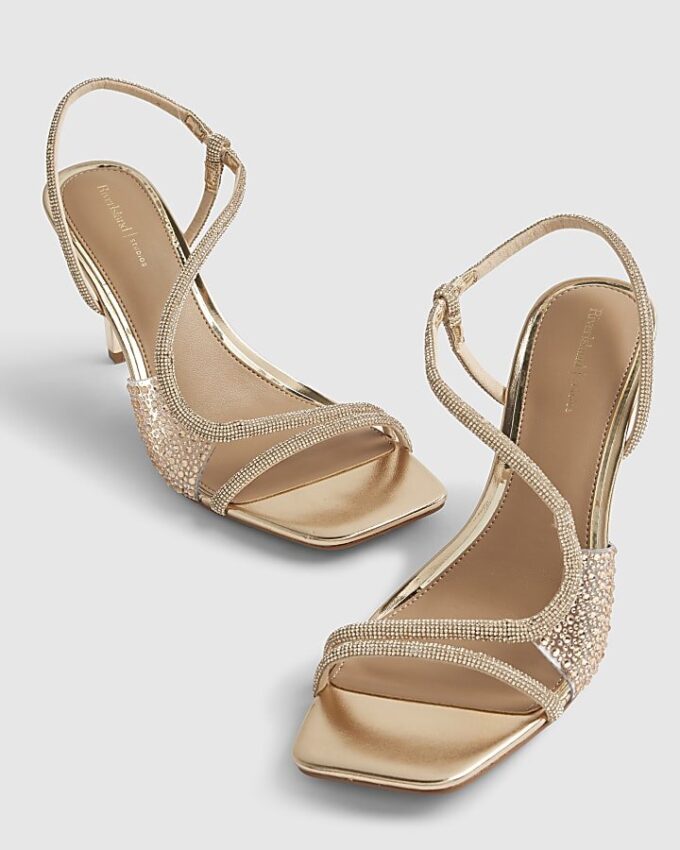 Guldfärgade sandaler med diamantklack i plexiglas