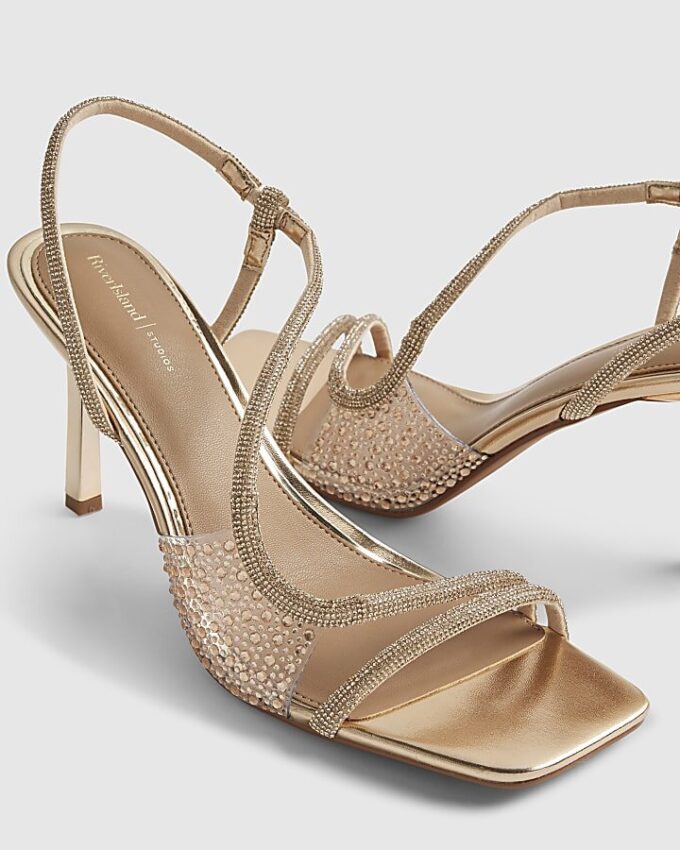 Guldfärgade sandaler med diamantklack i plexiglas