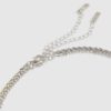 Halsband i silver med kors i blandade metaller