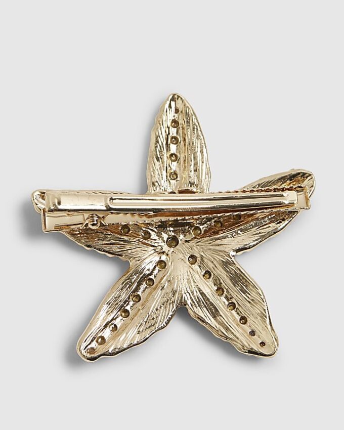 Hårklämma med guldfärgad diamantsimulant och sjöstjärna