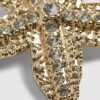 Hårklämma med guldfärgad diamantsimulant och sjöstjärna