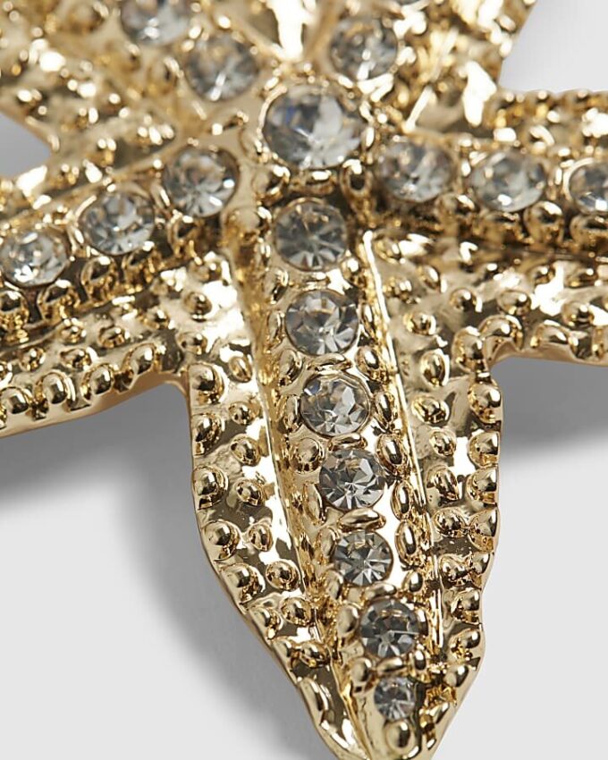 Hårklämma med guldfärgad diamantsimulant och sjöstjärna