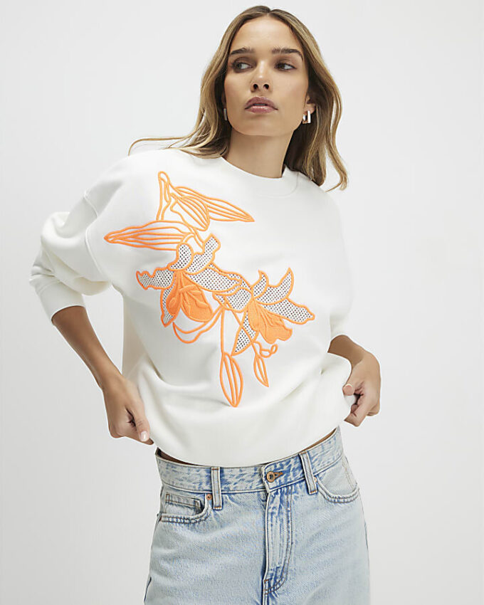 Krämfärgad blommig sweatshirt