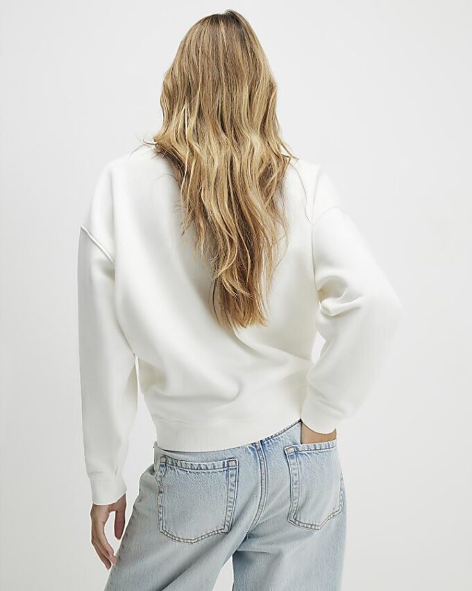 Krämfärgad blommig sweatshirt