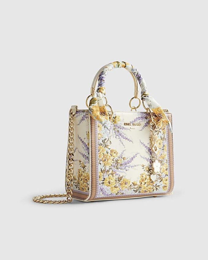 Krämfärgad blommig totebag