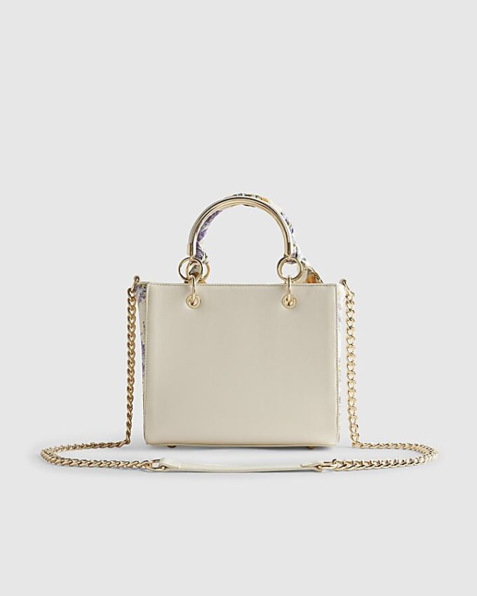 Krämfärgad blommig totebag