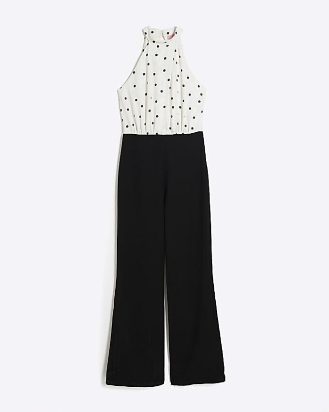 Krämfärgad jumpsuit med halterneck och prickar