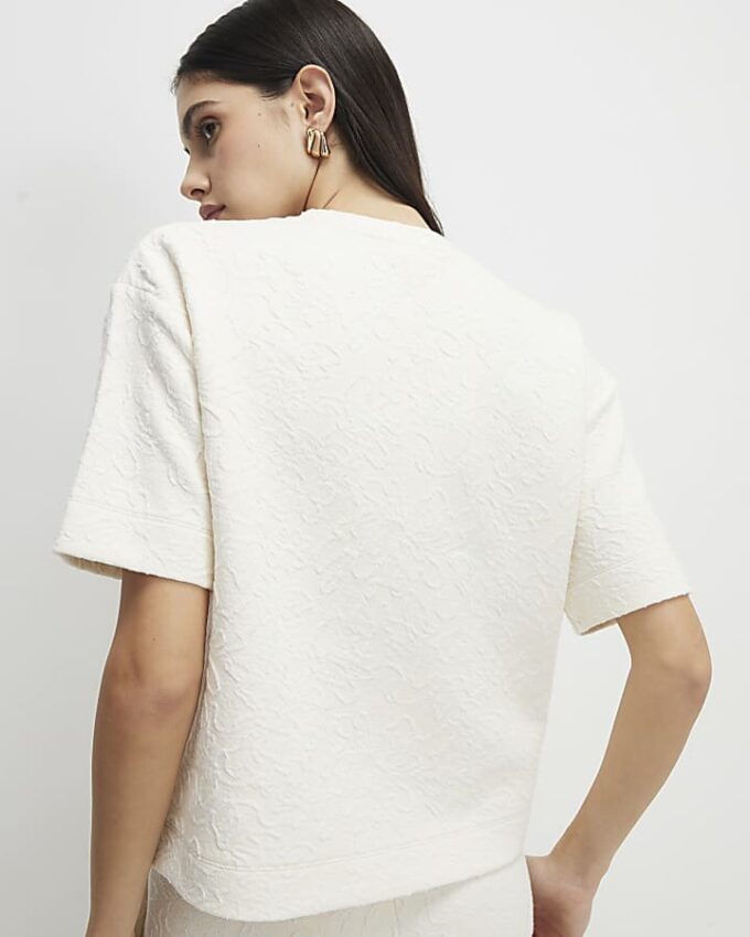 Krämfärgad kortärmad jacquard-T-shirt med boxig passform