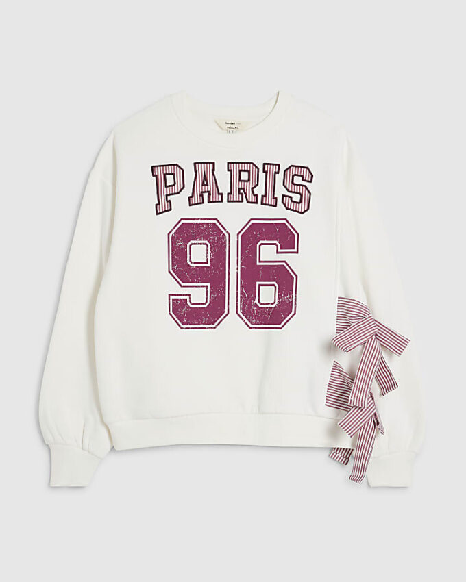 Krämfärgad långärmad tröja med rosett i Paris-stil