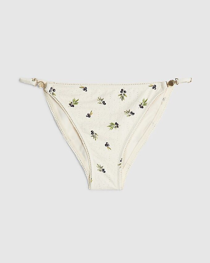 Krämfärgade bikinitrosor med olivtryck