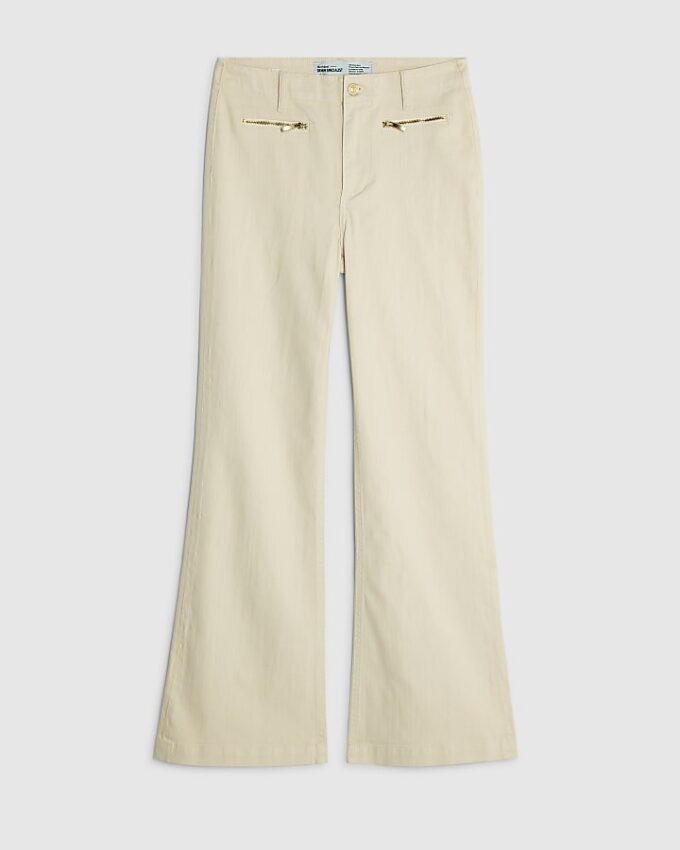 Krämfärgade jeans med dragkedja fram och avslappnad passform Krämfärgade jeans med dragkedja fram och avslappnad passform