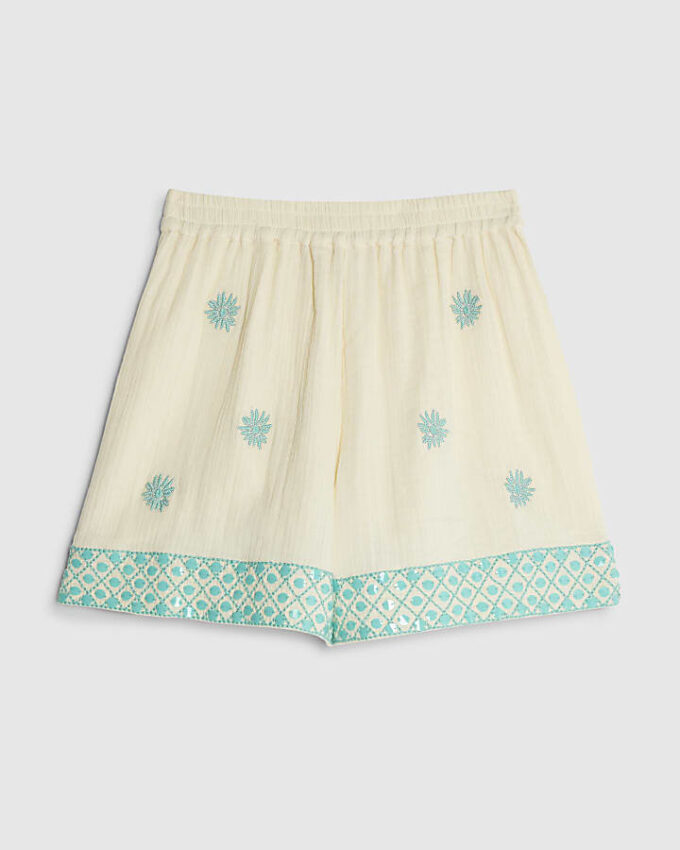 Krämfärgade shorts med paljetter