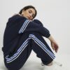 Marinblå joggingbyxor med vida ben och sidostriper