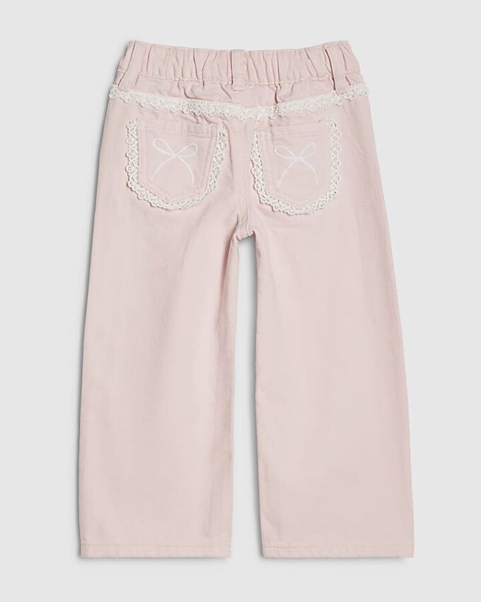 Mini Girls rosa jeans med breda ben och spetsrosett