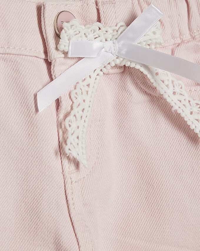 Mini Girls rosa jeans med breda ben och spetsrosett