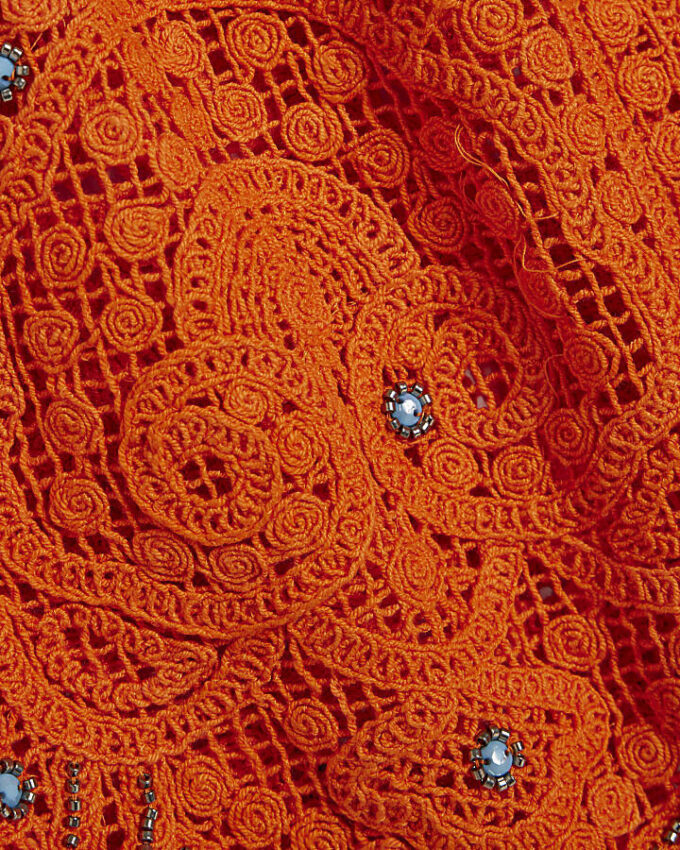 Orange strandshorts med virkade detaljer