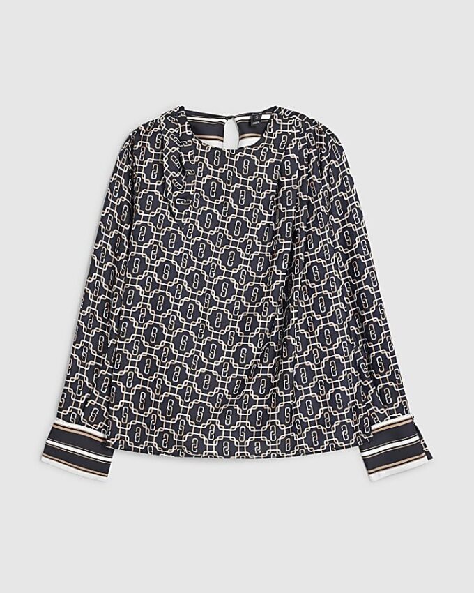 Petite svart blus med geometriskt tryck