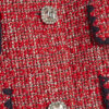 Röd boucléjacka med whipstitch