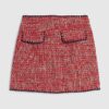 Röd minikjol i bouclé med whipstitch