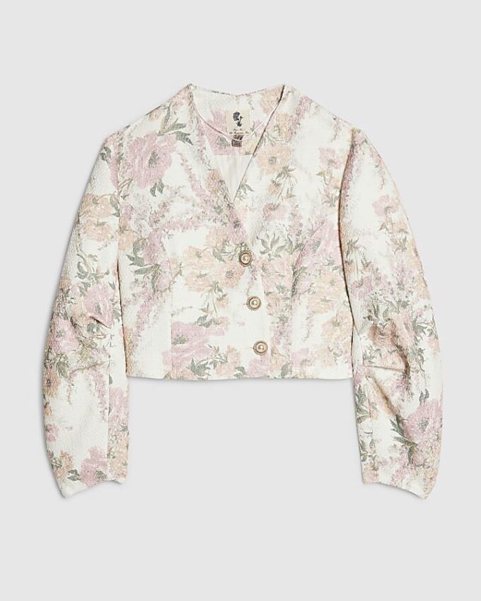 Rosa boucléjacka med blommönster och cocoonärmar