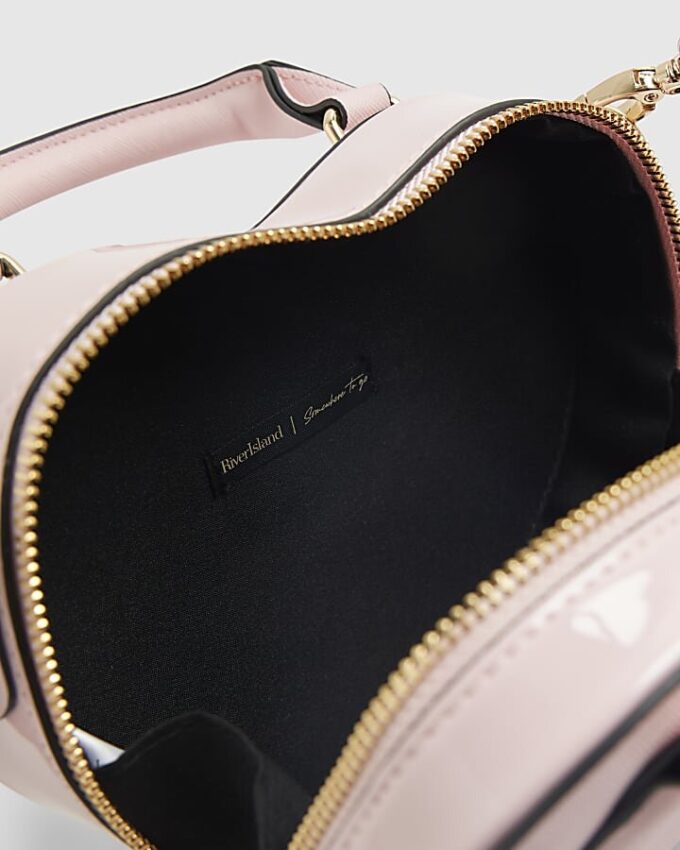Rosa hjärtformad crossbody-väska