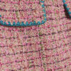 Rosa minikjol i bouclé med whipstitch