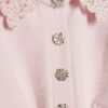 Rosa topp med volangärmar och strasspeplum