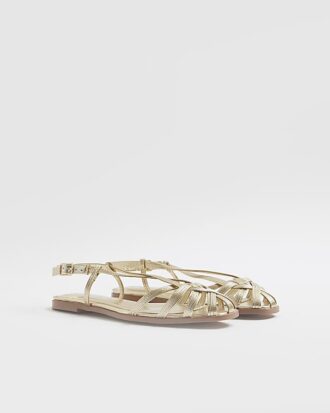 Sandaler i guldfärgat konstläder med burdesign