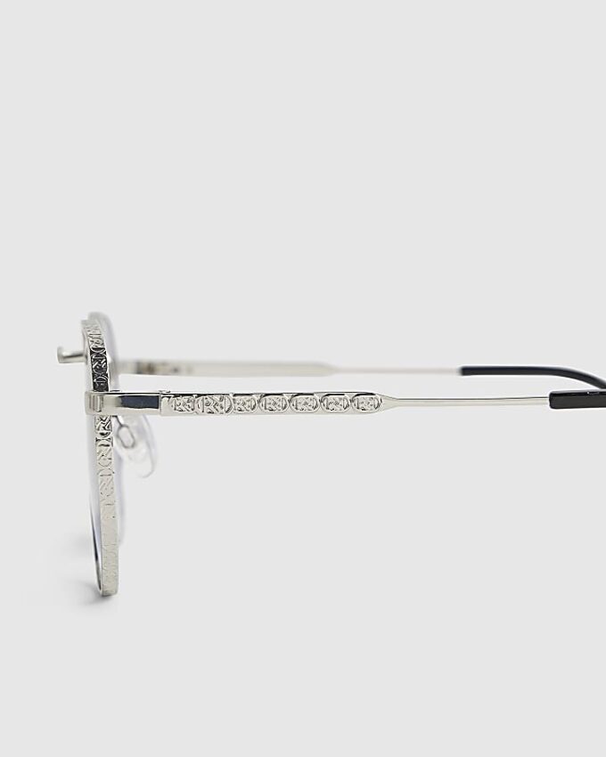 Silverfärgade solglasögon med monogram och sexkantig form
