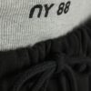 Svart 2-i-1 joggingbyxa med vida ben