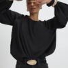 Svart blus med bubbelkant