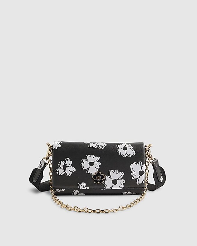 Svart crossbody-väska med daisy-tryck