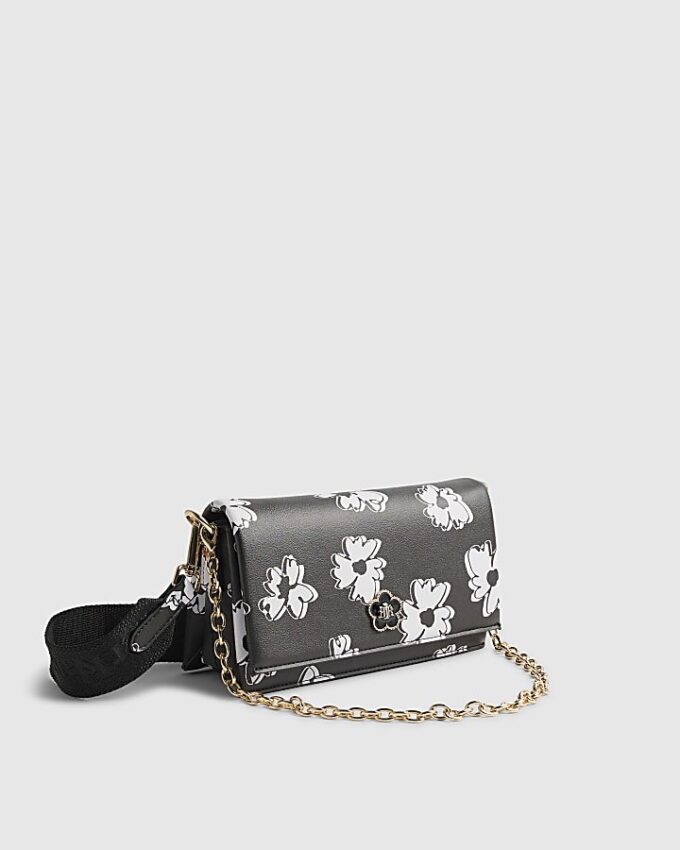 Svart crossbody-väska med daisy-tryck