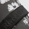 Svart crossbody-väska med daisy-tryck