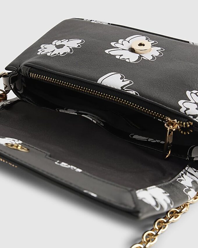 Svart crossbody-väska med daisy-tryck