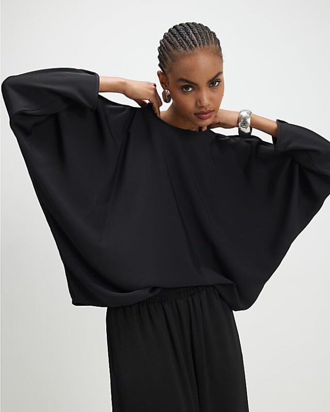 Svart långärmad batwing-top