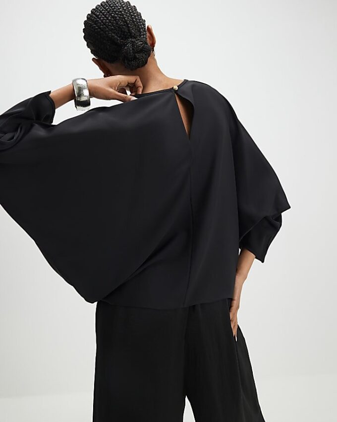 Svart långärmad batwing-top