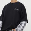 Svart oversized-passad T-shirt med lager på lager-mönster Svart oversized-passad T-shirt med lager på lager-mönster