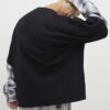 Svart oversized-passad T-shirt med lager på lager-mönster Svart oversized-passad T-shirt med lager på lager-mönster