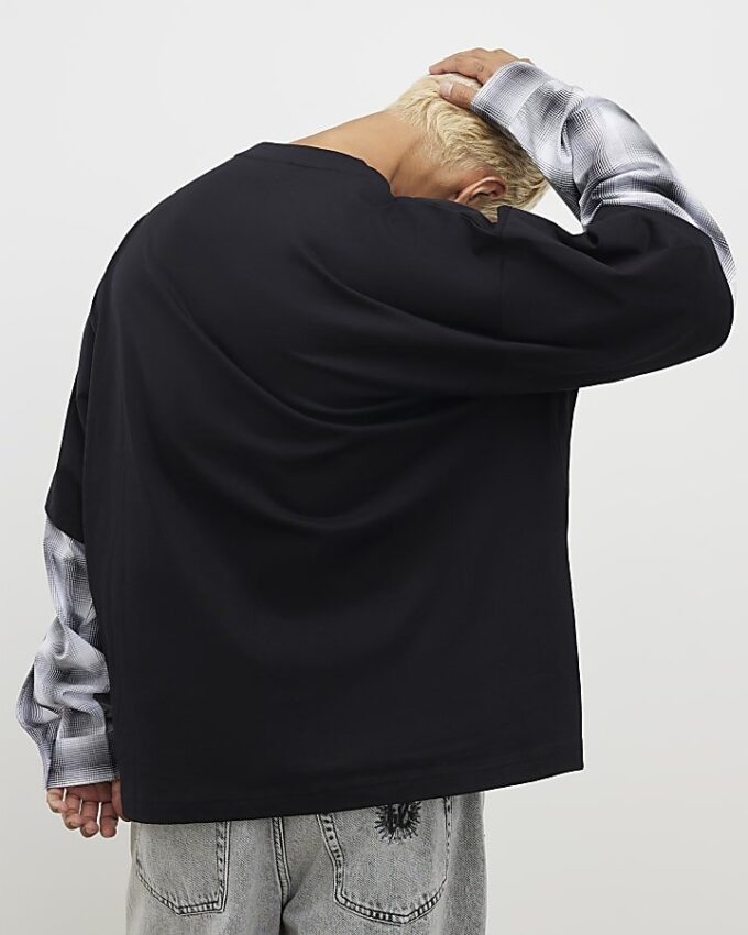 Svart oversized-passad T-shirt med lager på lager-mönster Svart oversized-passad T-shirt med lager på lager-mönster