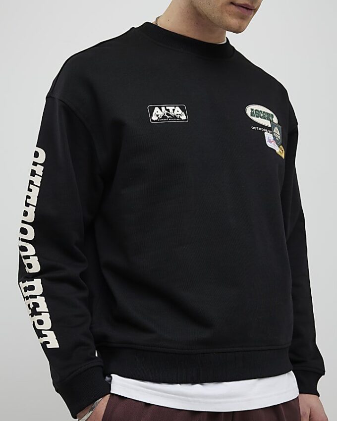 Svart oversized-passformad tröja med alpin badge