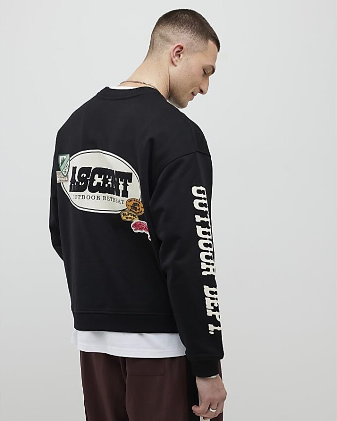 Svart oversized-passformad tröja med alpin badge