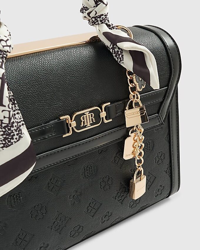 Svart präglad charm-tote